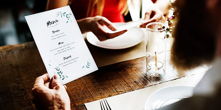 Restaurant owner selects custom labels and printed materials to strengthen brand identity and customer experience